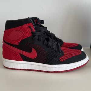 Size 4.5 Y = women’s 6 black and red Jordan 1 Nike 1985 knit exclusive